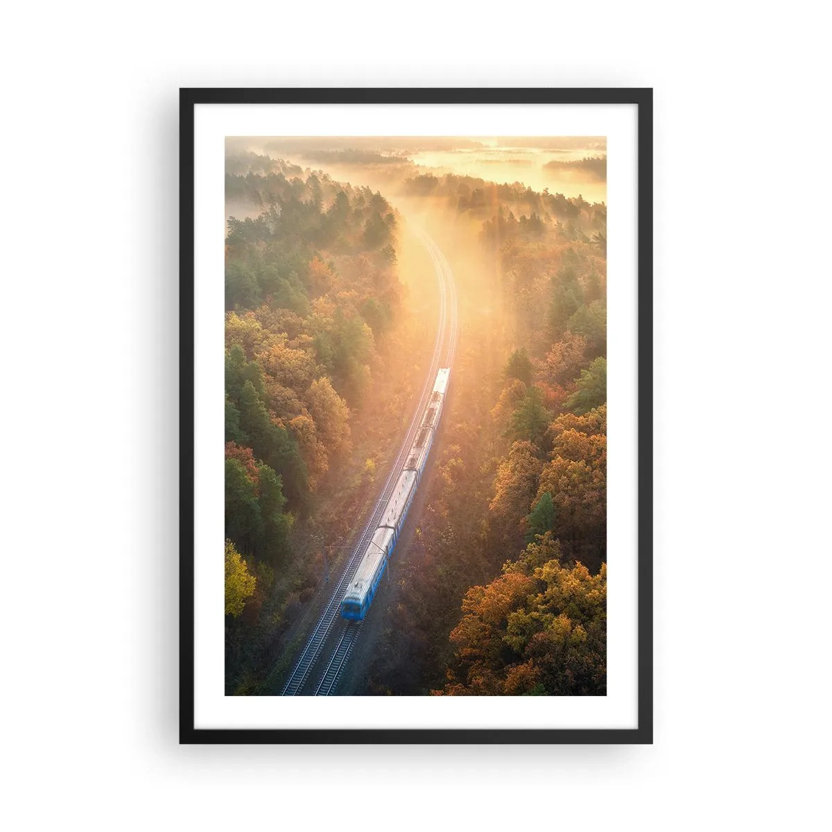 Poster in een zwarte lijst - Een trein die door een herfstbos rijdt in de stralen van de opkomende zon - 50x70cm - Herfst reis - Moderne wanddecoratie voor woonkamer en slaapkamer ARTTOR