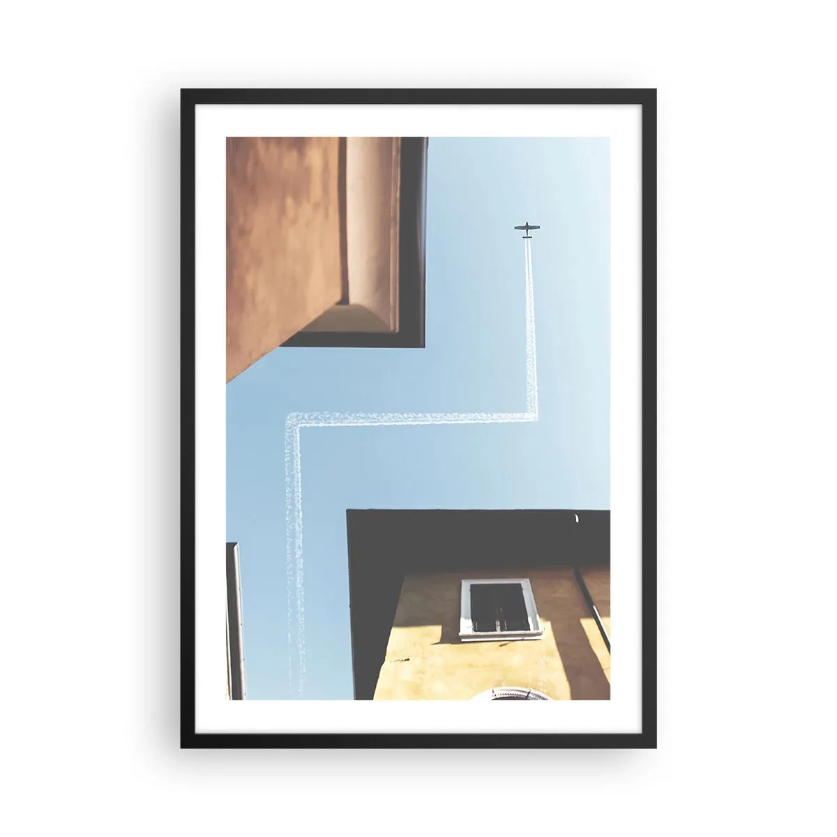 Poster in een zwarte lijst - Perspectief van gebouwen met een vliegtuig en een ongewoon pad in de lucht - 50x70cm - Boven het doolhof van de stad - Moderne wanddecoratie voor woonkamer en slaapkamer ARTTOR